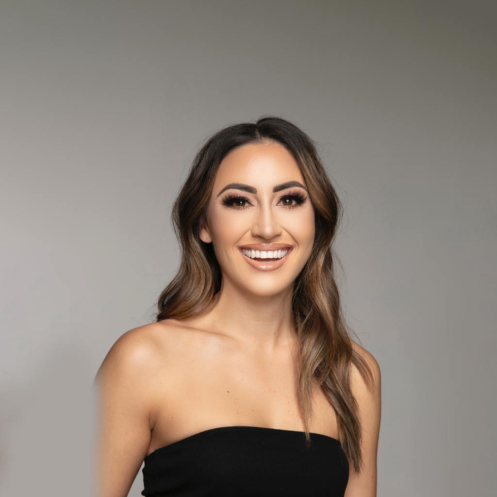 Woman smiling and looking at camera