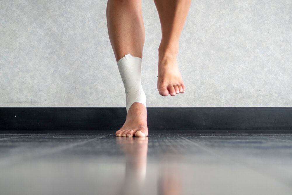 Athlete balancing to regain proprioception on sprained ankle