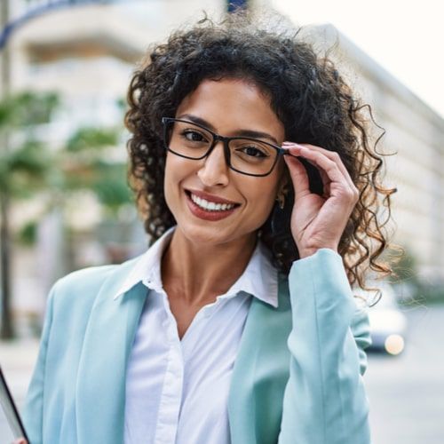 Young hispanic business woman wearing professional look smiling confident