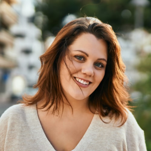 Young irish plus size girl smiling happy standing at the city.