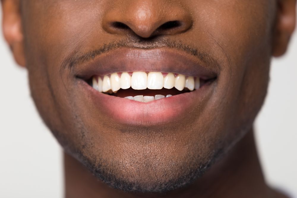 man with healthy straight clean teeth