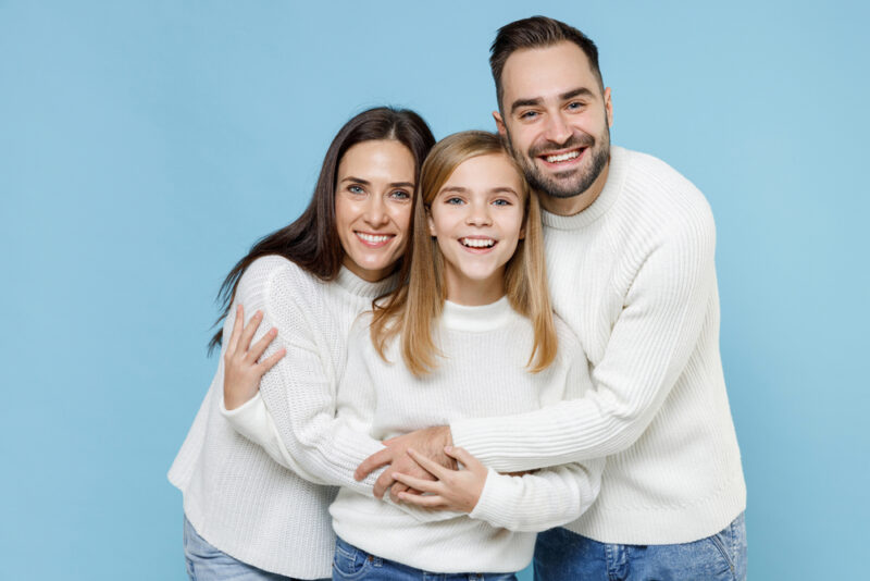 Laughing fun young happy parents mom mama dad papa with child kid daughte