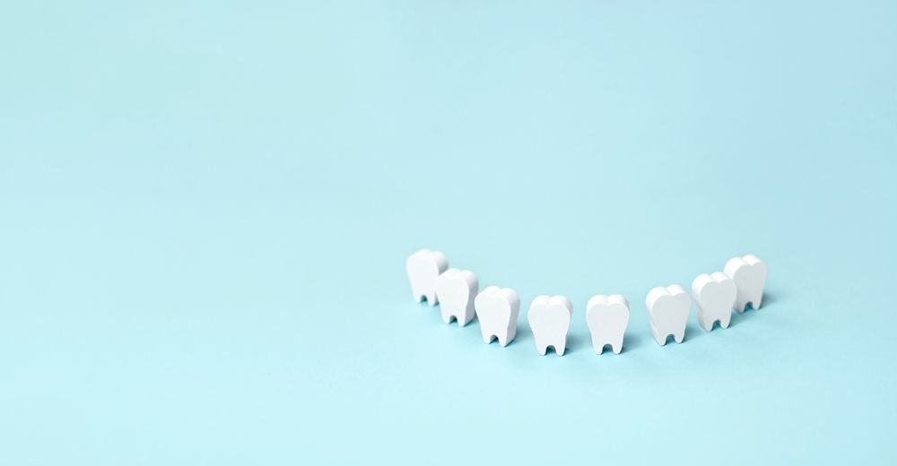 Teeth models standing in a row making a smile