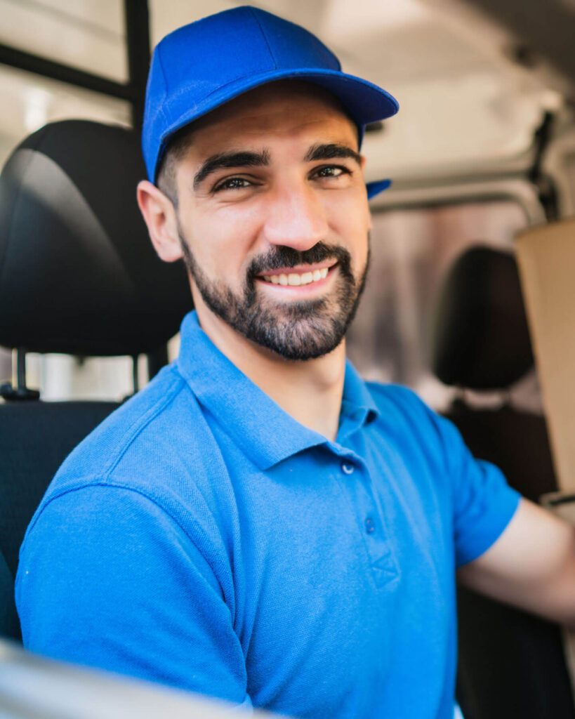 Portrait of a delivery man checking the delivery list