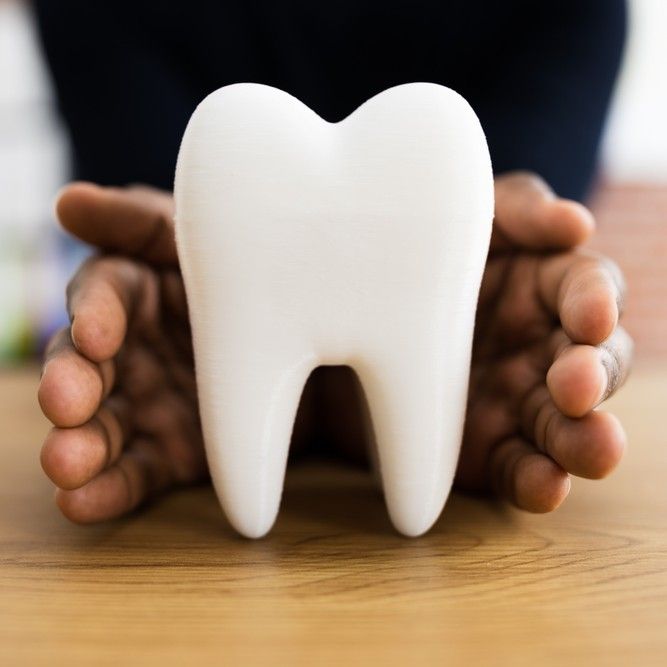 Dental Tooth Insurance And Replace Enamel Service. African American Man