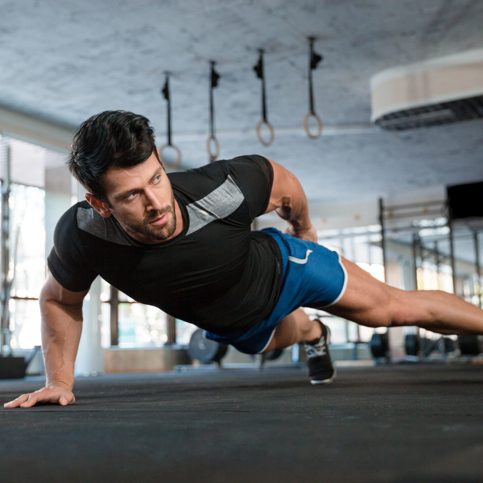 Portrait of a handsome man doing push ups