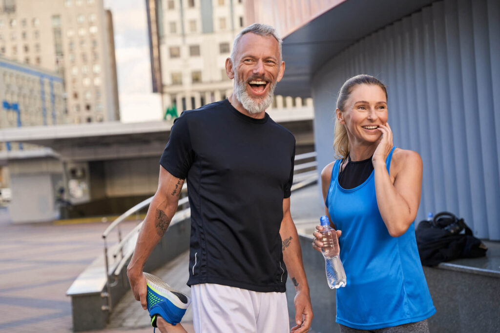 Portrait of happy sportive middle aged couple