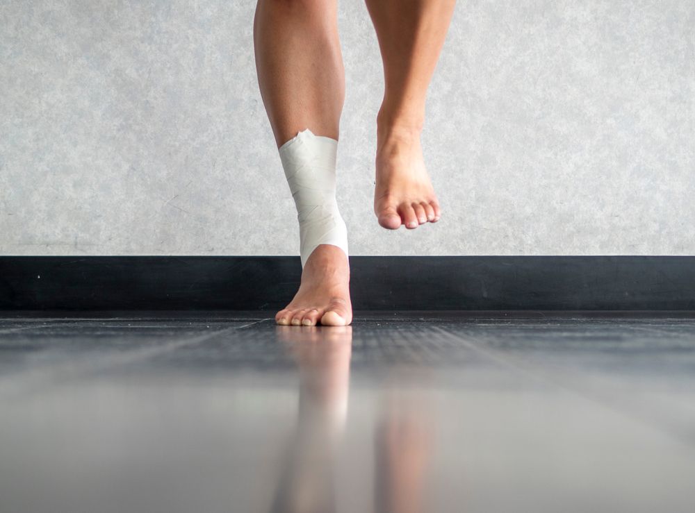 Athlete balancing to regain proprioception on sprained ankle