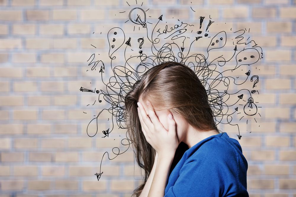 Young woman with worried stressed face expression with illustration
