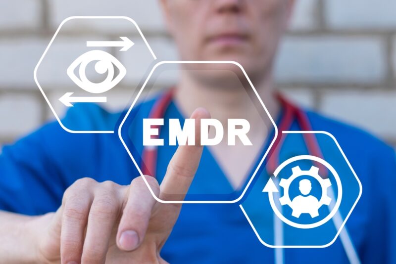 Doctor using virtual touchscreen presses abbreviation: