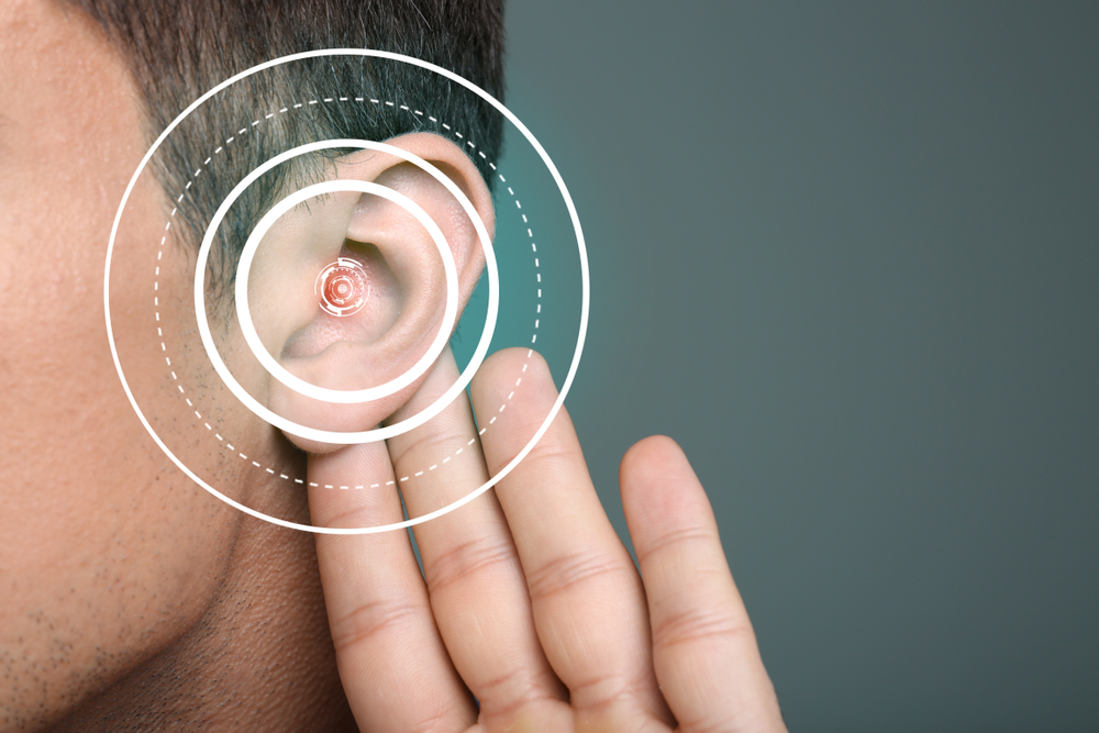 Young man with symptom of hearing loss