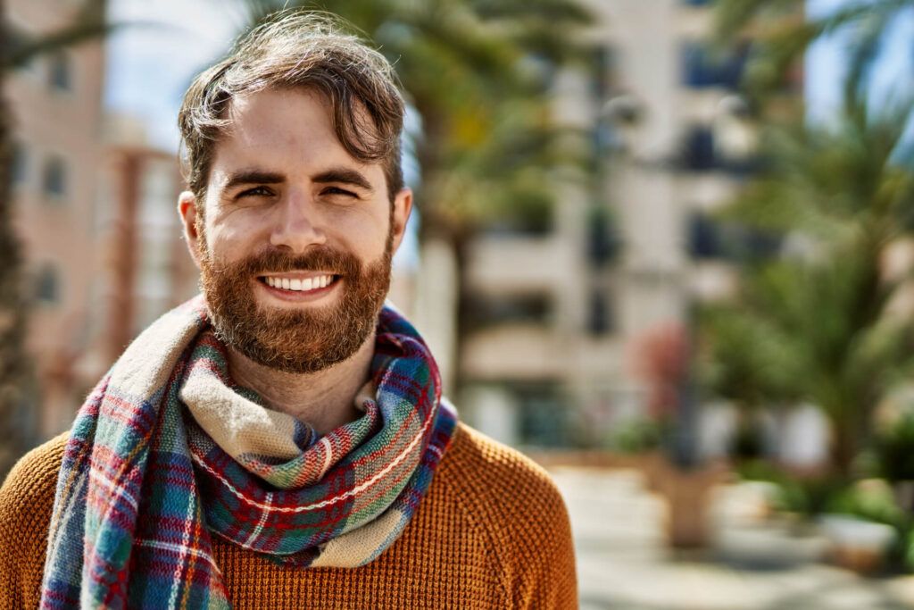 Young caucasian man with beard outdoors on a sunny day