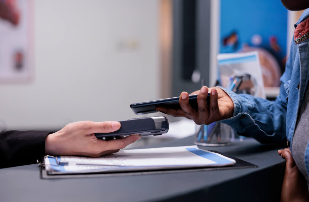 Patient using credit card to pay checkup visit