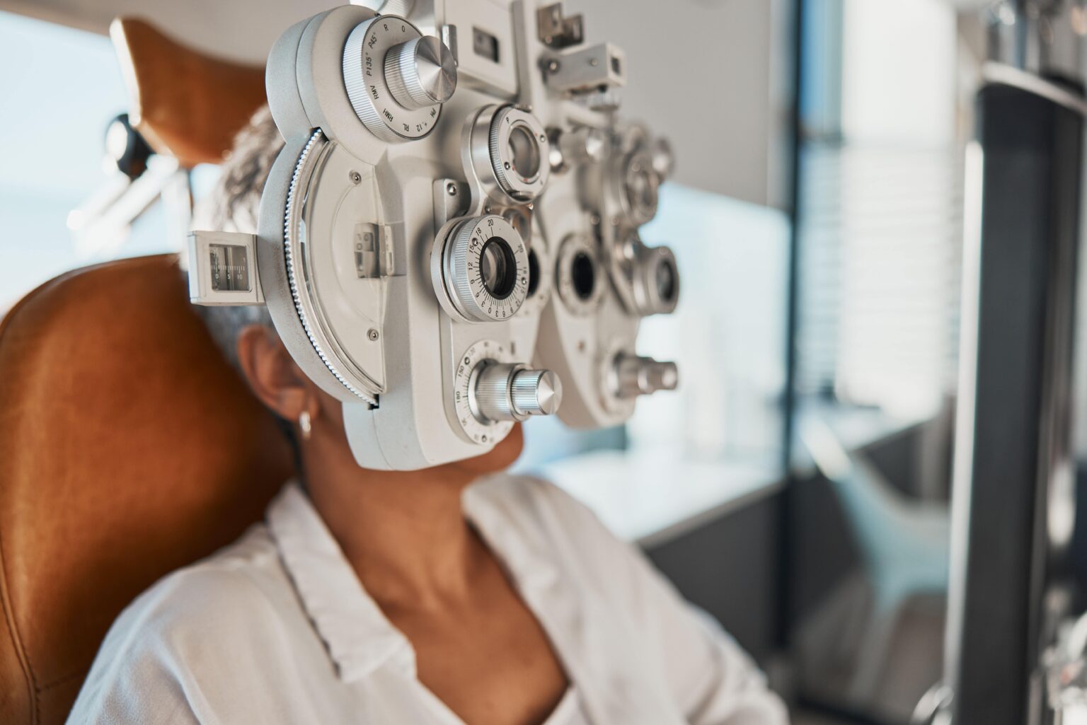 eye exam and woman in optometry