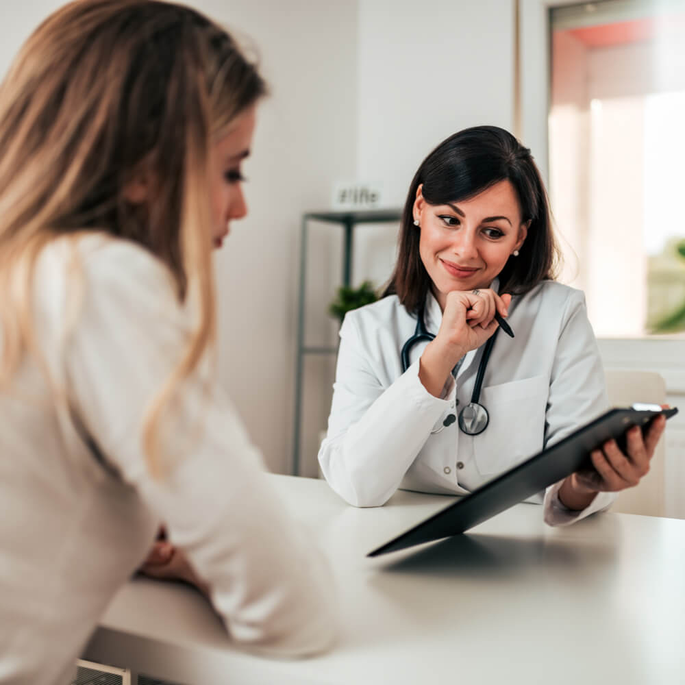 Smiling doctor consulting her patient.