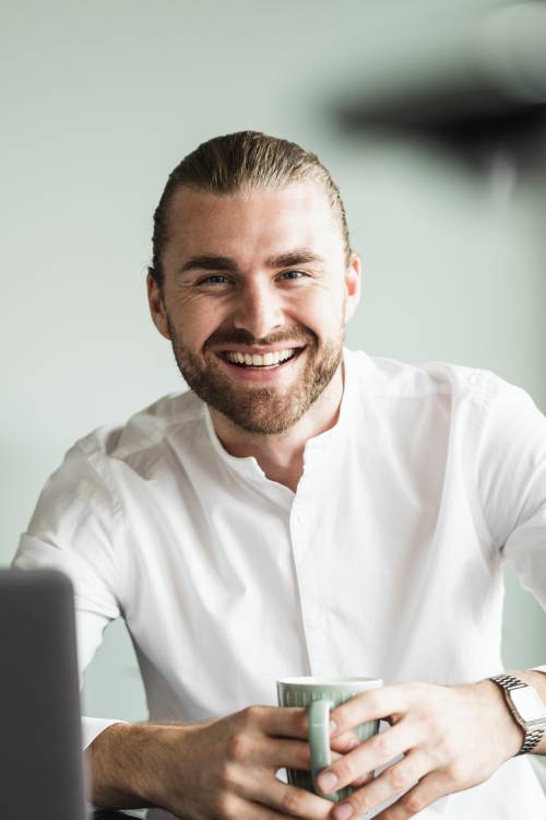 Young man with white shirt smiling