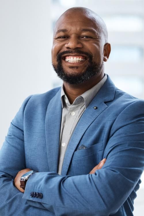 African American man in suite smiling