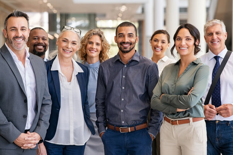 Portrait of successful group of business people at modern office