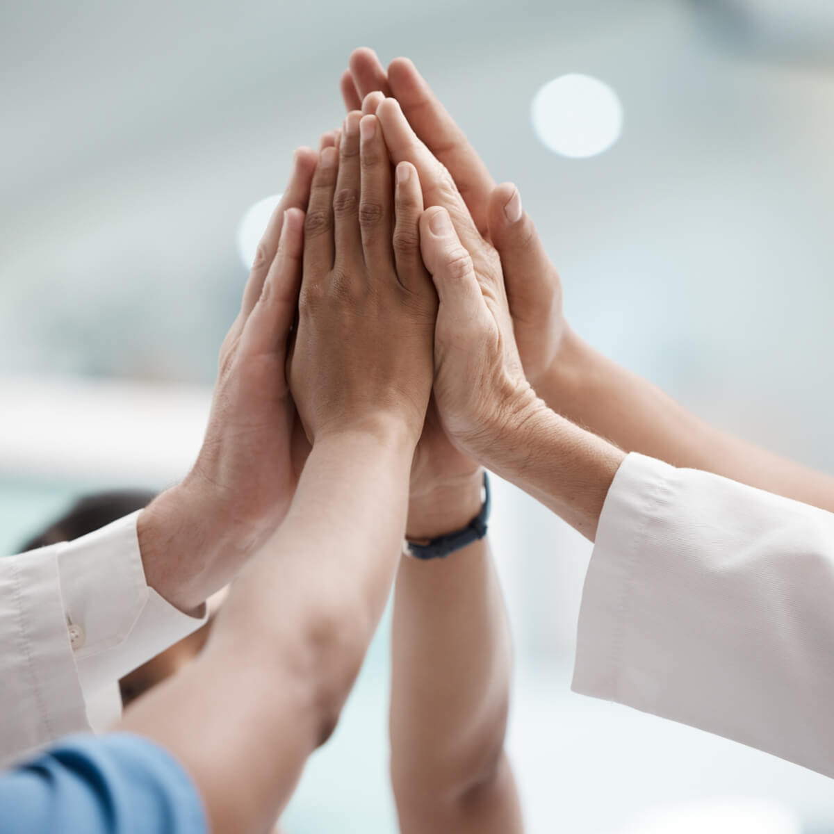 High five, teamwork and doctors hands