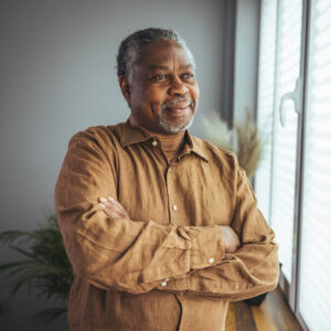 smiling senior african american man at home