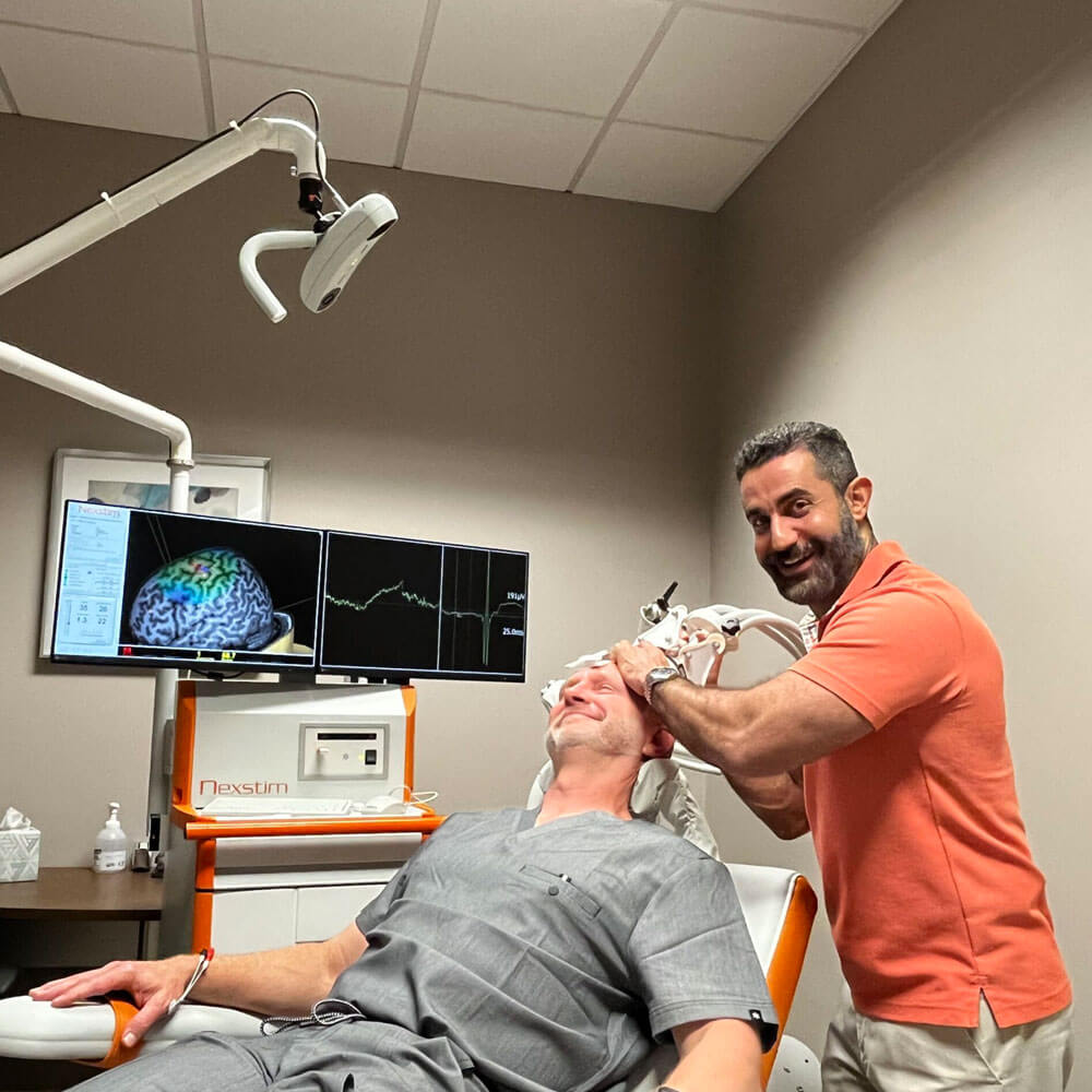 Happy Doctor and patient in treatment room