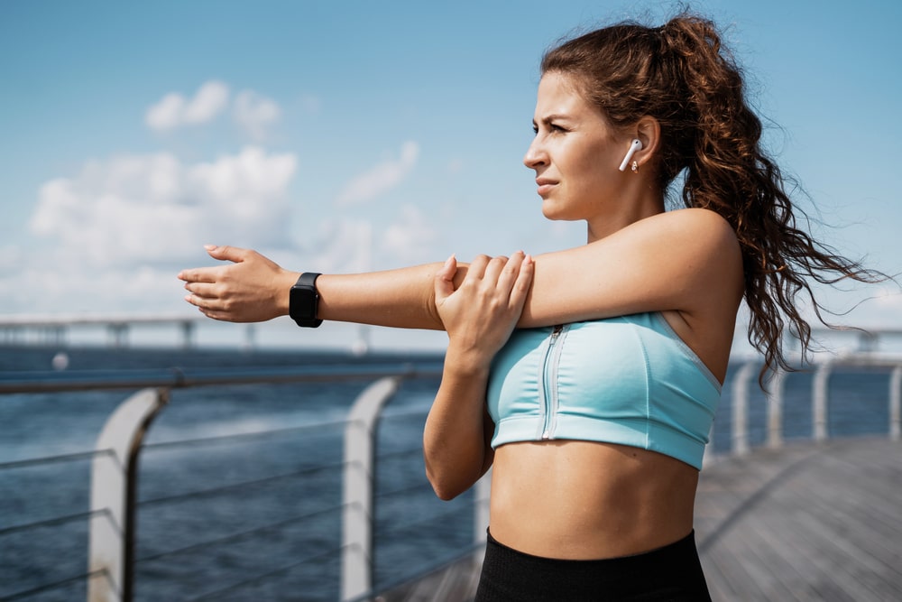 The trainer is engaged in fitness on the street