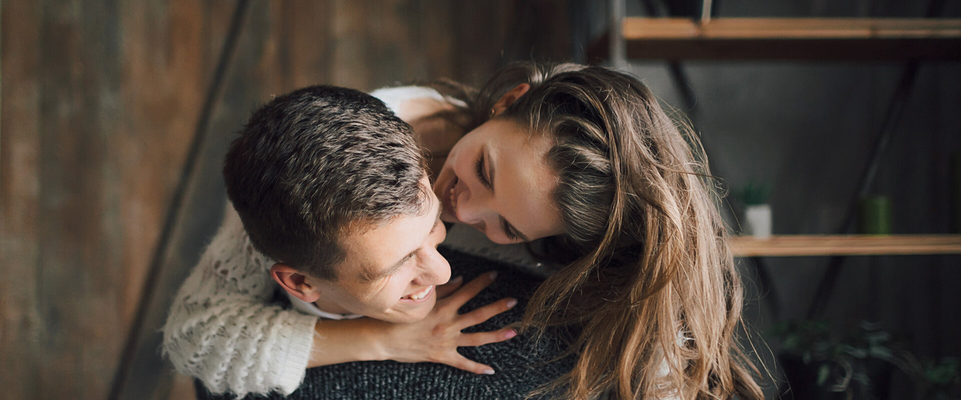 Young girl having a ride on her boyfriend's back.