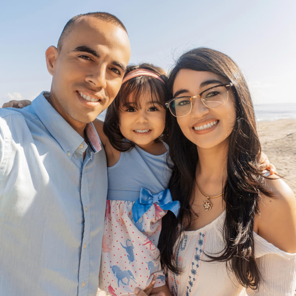 Happy family spending good time at the beach