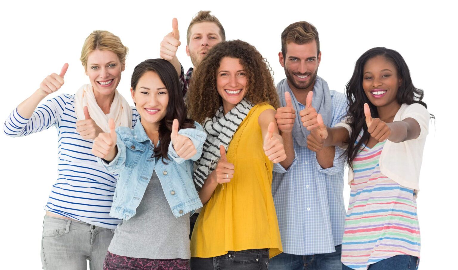 A group of people smiling with whitened teeth and giving a thumbs up.