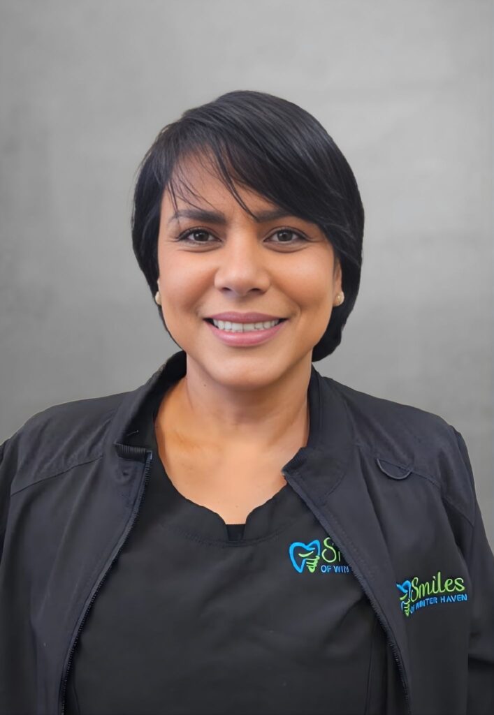 Female Dental Assistant with short, dark hair