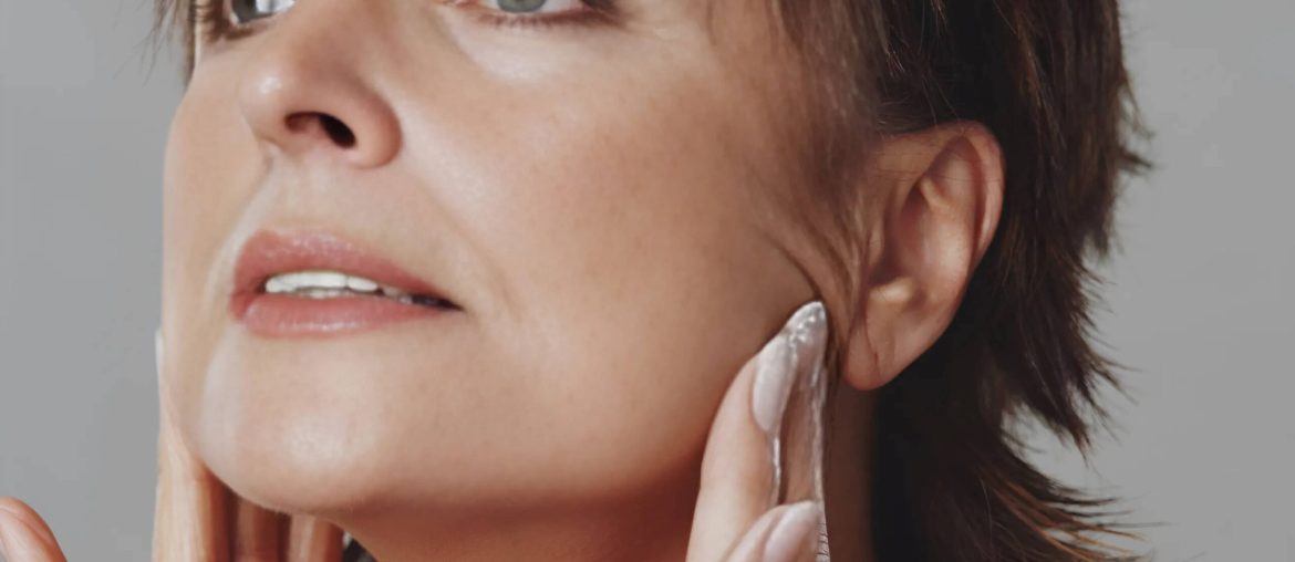 Woman examining her jaw for bone loss