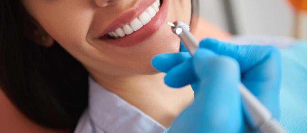 Woman having dental treatment at dental clinic