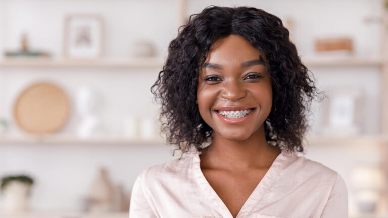 Girl With Dental Brackets Posing At Home