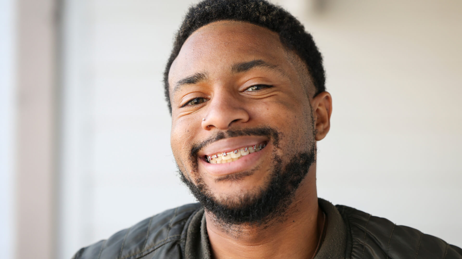 man smiling wearing braces