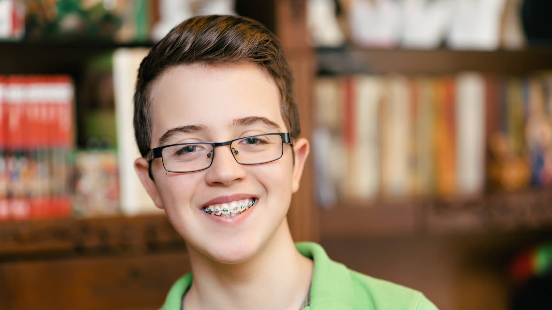 Happy boy with braces and glasses. smiling