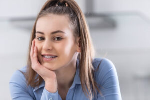 happy smiling girl with dental braces.