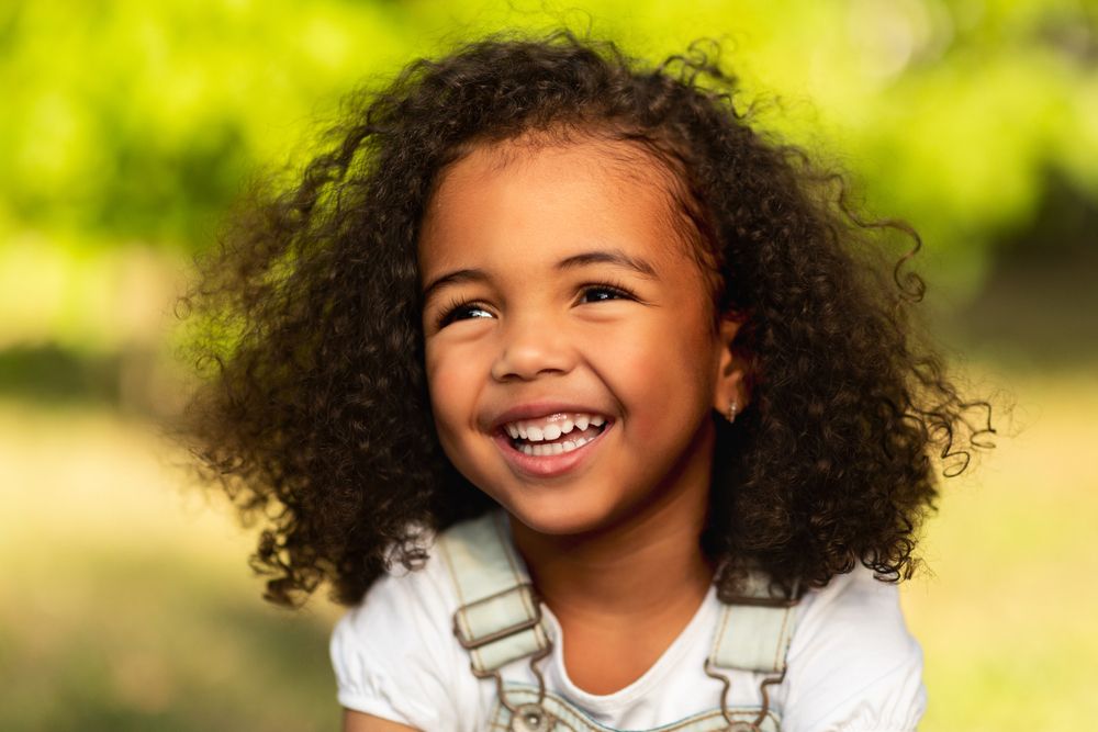 A smiling child in need for Children Orthodontic Treatment in Atlanta