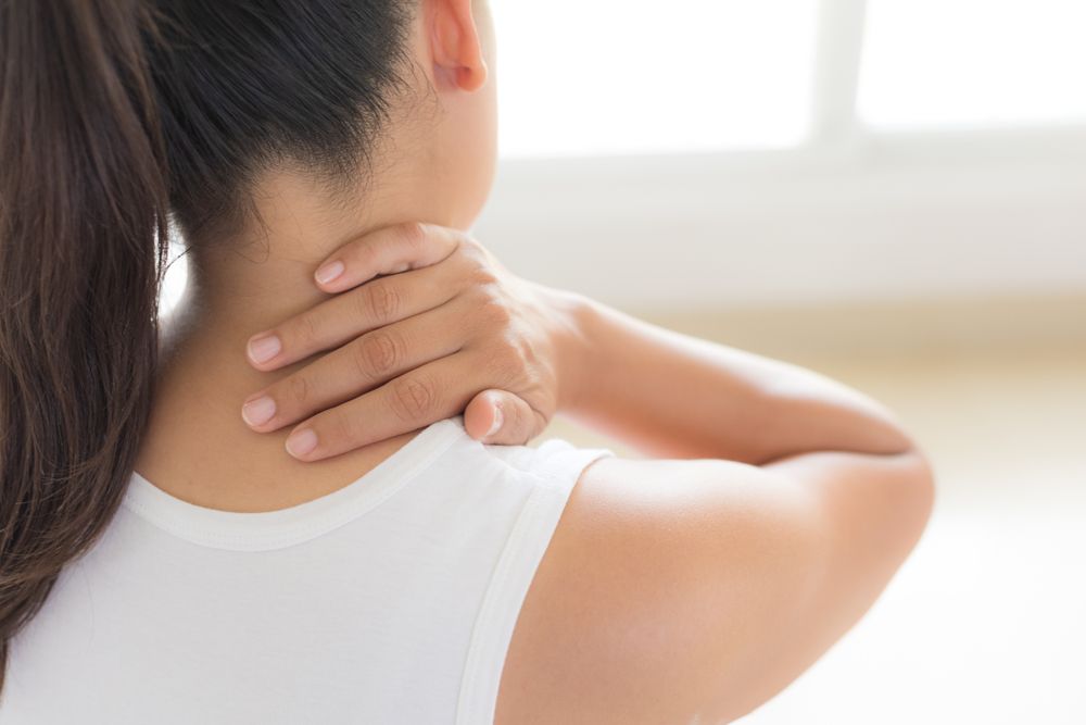 woman neck and shoulder pain and injury