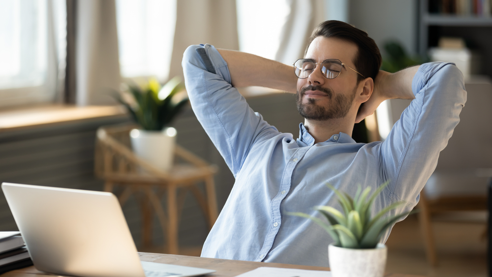 Calm man in glasses sit relax at workplace