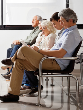 Row of multiethnic people sitting side by side