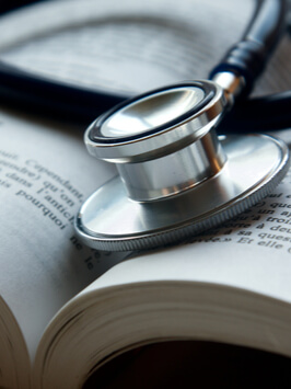 stethoscope on a pile of books