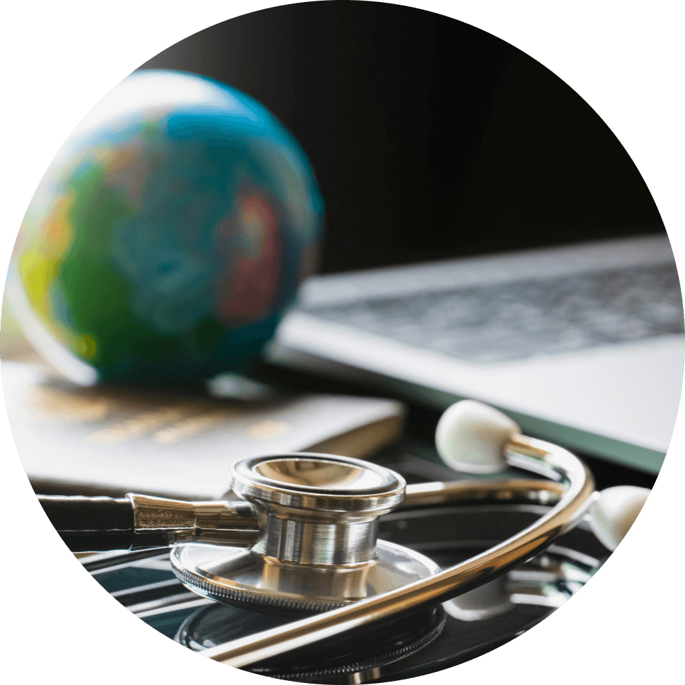 Blurred image of medical stethoscope, passport book, globe and laptop computer