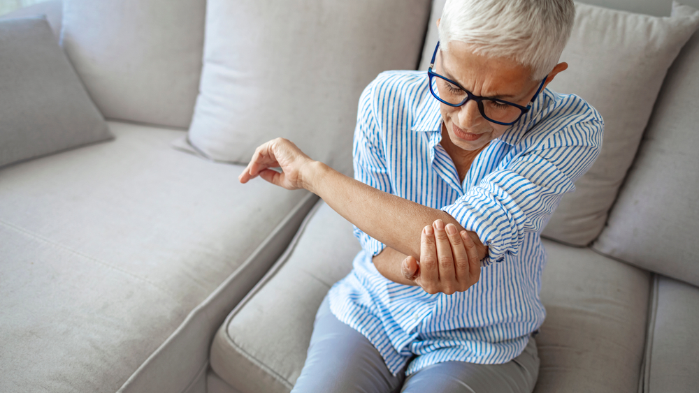 Woman Holding Her Elbow