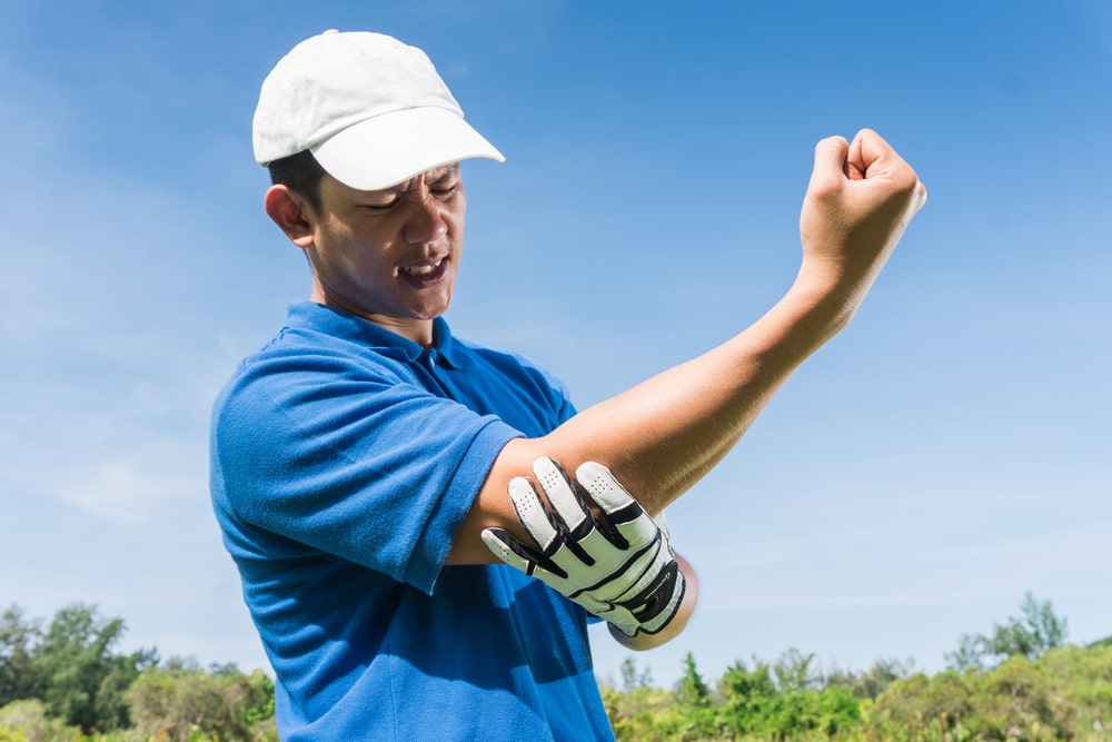 Man Holding His Hurt Elbow