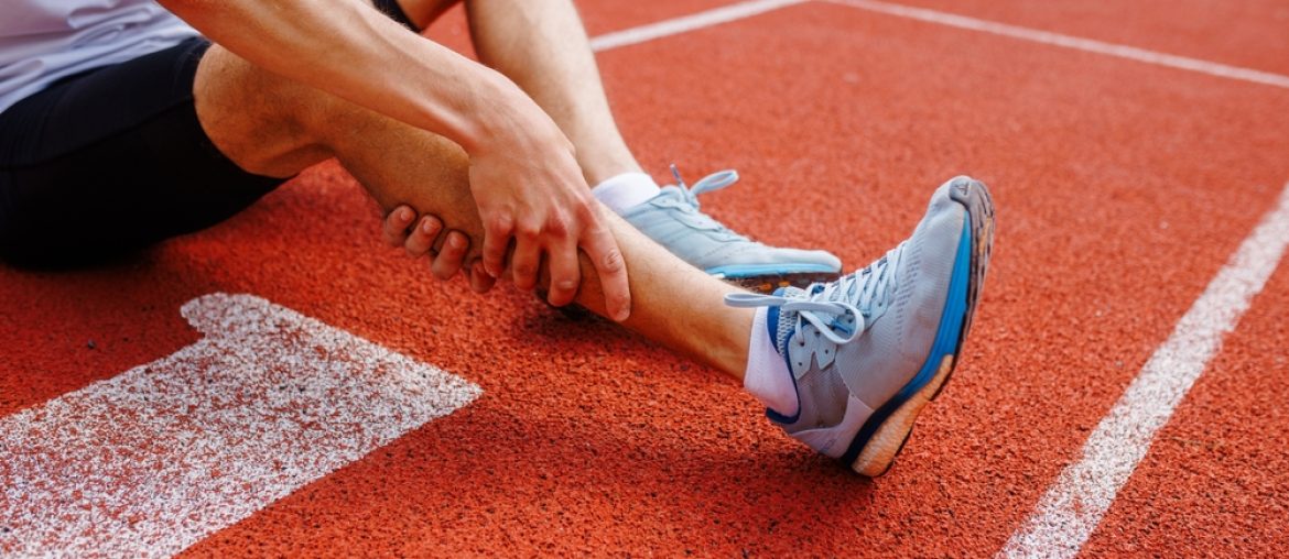 Athlete,Holding,His,Leg,Injured,After,Running,At,Track,And