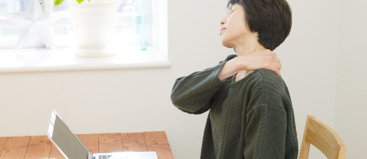 Woman Holding Her Shoulder In Pain