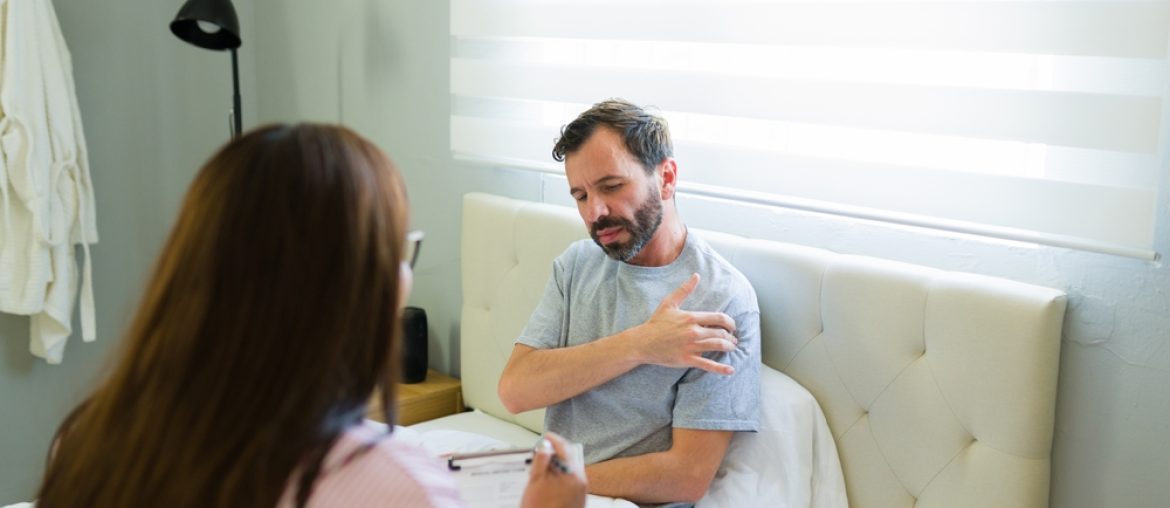 Female,Doctor,Visiting,A,Male,Patient,Recovering,From,Surgery,At