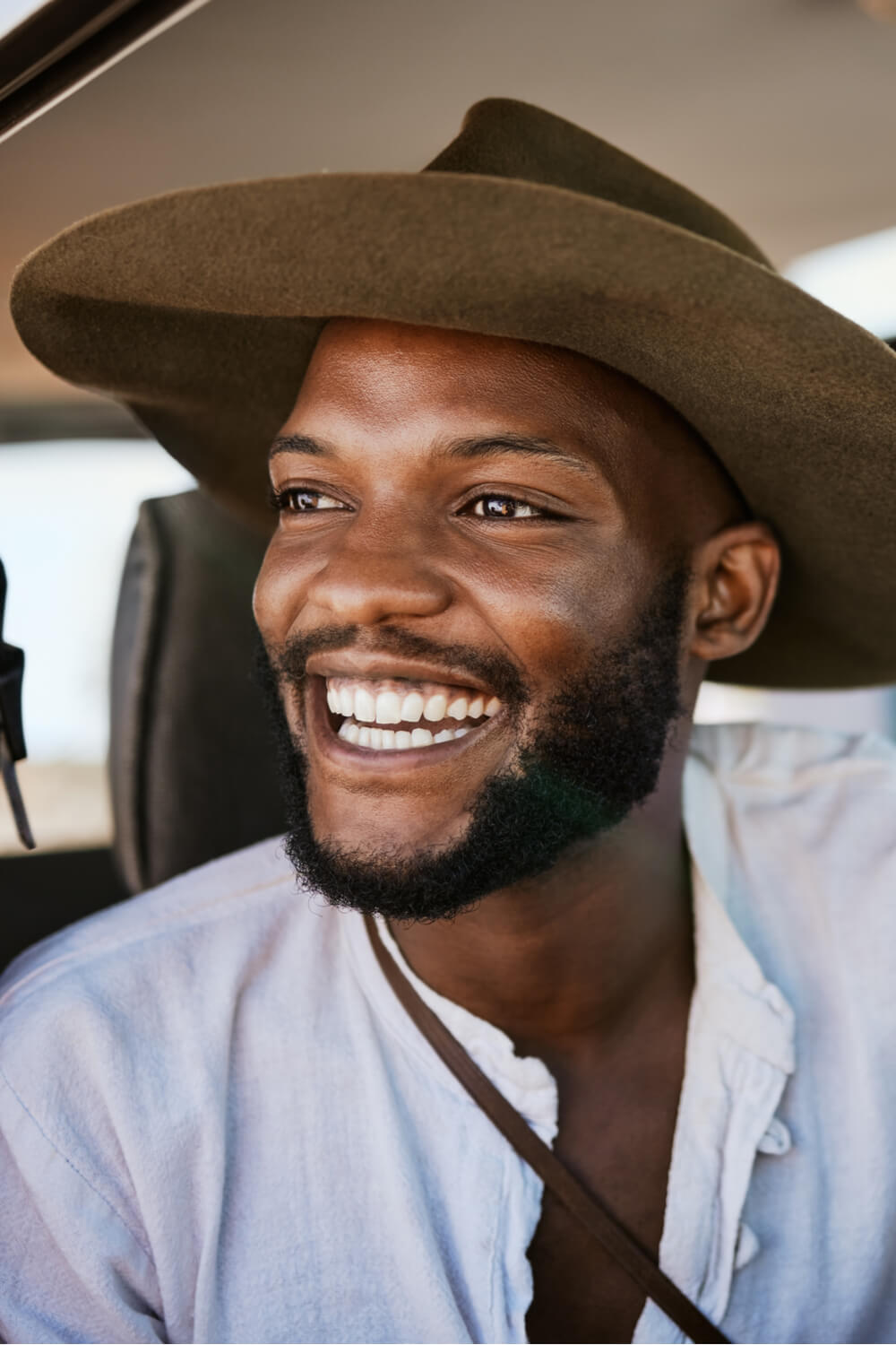 Happy, taxi and driver with black man driving