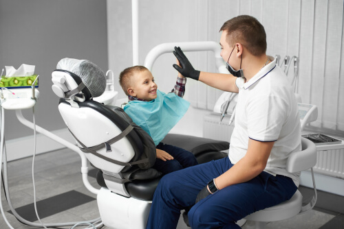 A child is happy after dental treatment