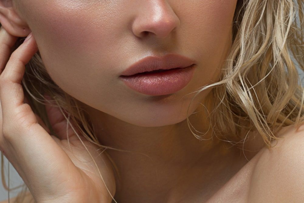 Natural gloss of lips and woman's skin